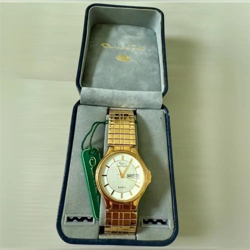 Oscar de la Renta Gold and White Watch needs new batteries